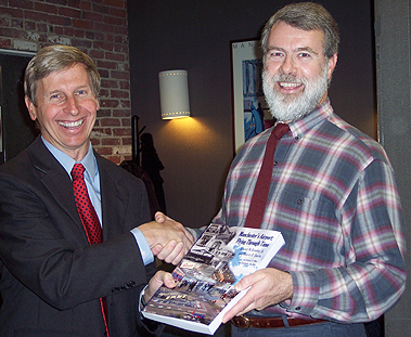 NH Governor John Lynch receives a copy of Manchester's Airport: Flying Througjh Time from co-author Ed Brouder